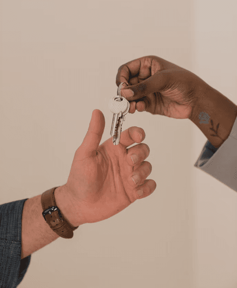Image of a hand holding a key